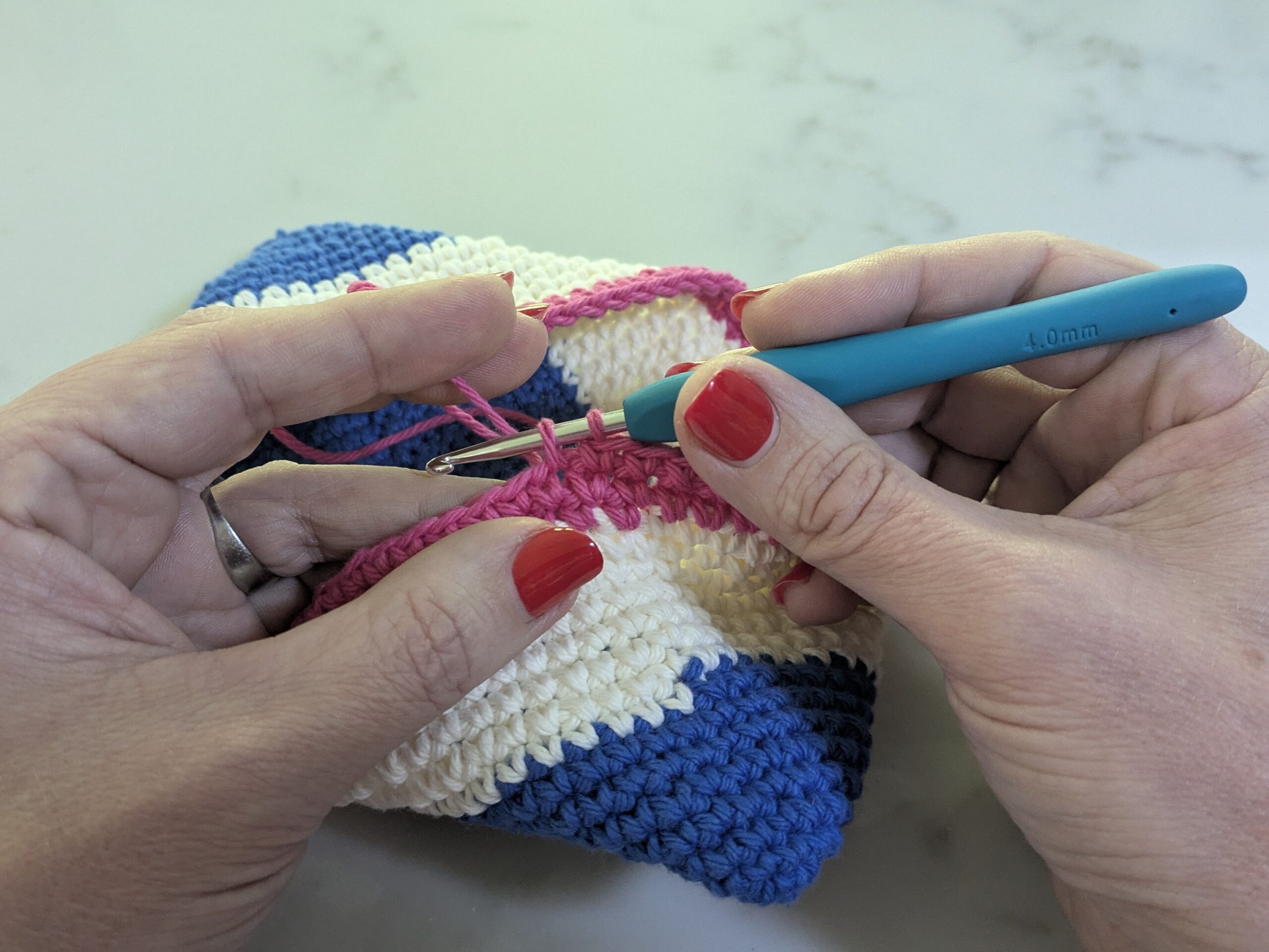 Photo of crochet potholder in trans colors